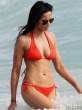 padma-lakshmi-in-an-orange-bikini-at-the-beach-10-435x580.jpg